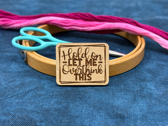 Photo of a needle minder featuring the quote, 