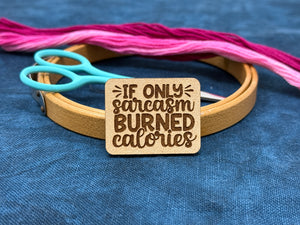 Photo of a needle minder featuring the quote, "If Only Sarcasm Burned Calories."