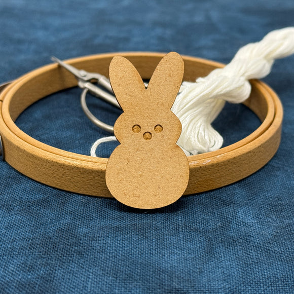 Photo of a needle minder in the shape of a marshmallow Easter Bunny.