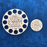 Round laser cut wood needle minder saying "Have Yourself A Spooky Little Christmas with matchin thread keep embroidery floss organizer.