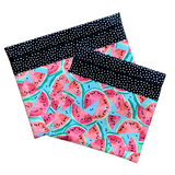 Fabric project bags with pink and coral watermelons on a blue background. Black with white dot accent fabric. Small and medium sizes.